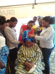 Empowerment Pictures - tying of gele at Christ Orphange Home